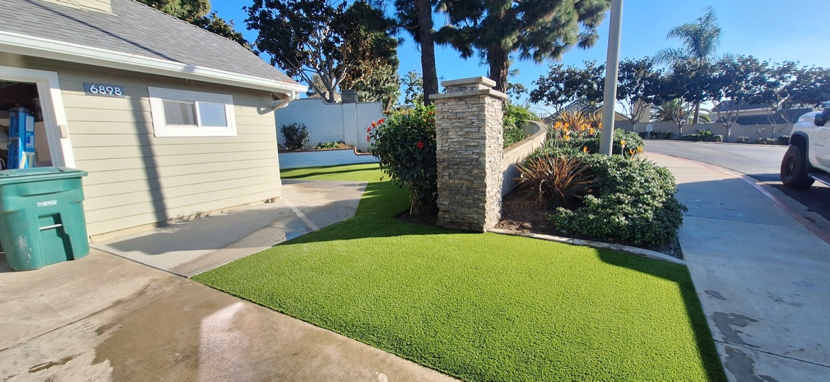 Front lawn turf installation with stone pillar in North County San Diego