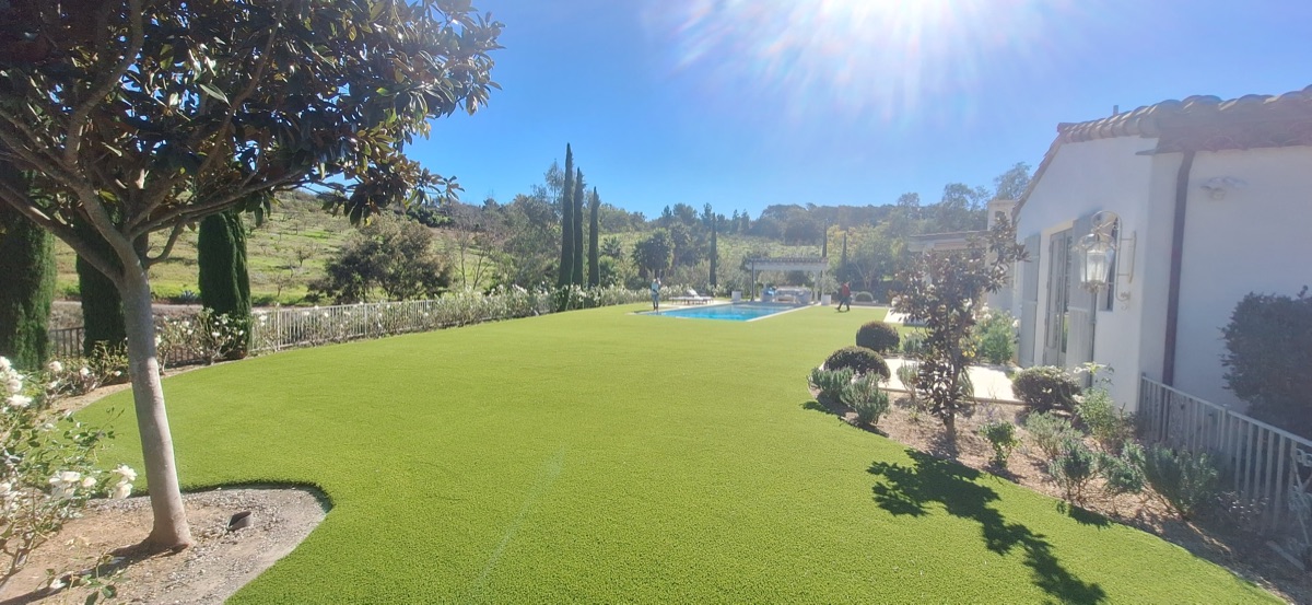 Luxury estate turf installation with pool and mountain views
