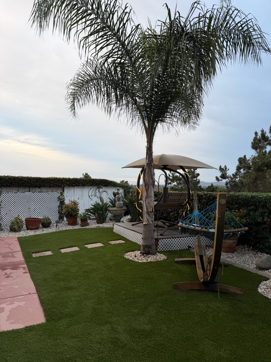Backyard oasis with turf and hardscaping in North County San Diego