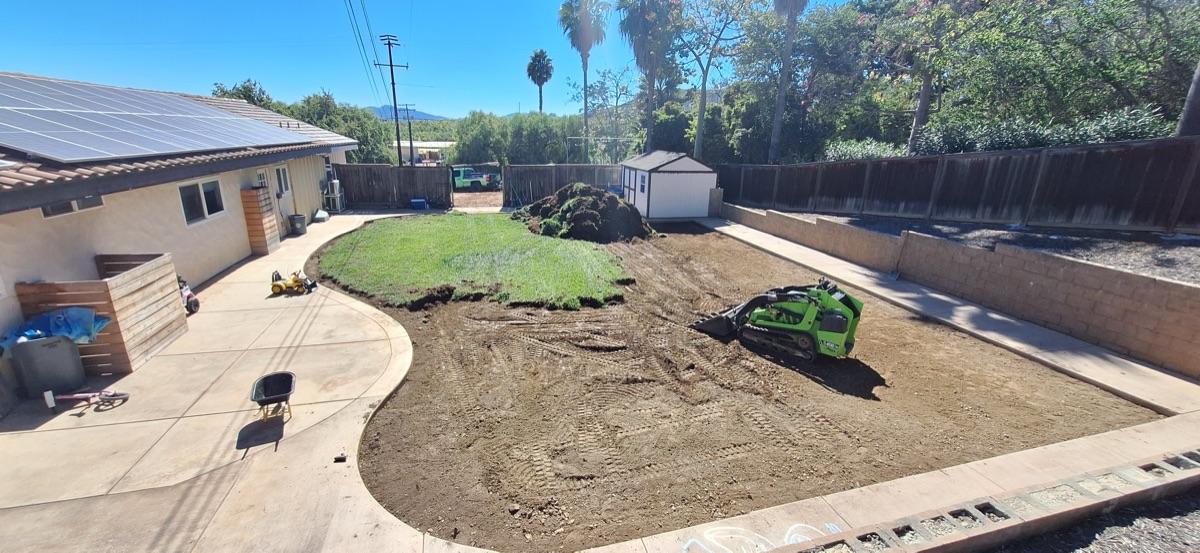 Grass removal with machinery before turf installation in Vista CA