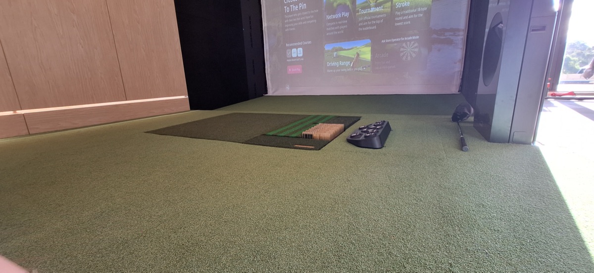 Indoor golf simulator turf installation in Vista, CA