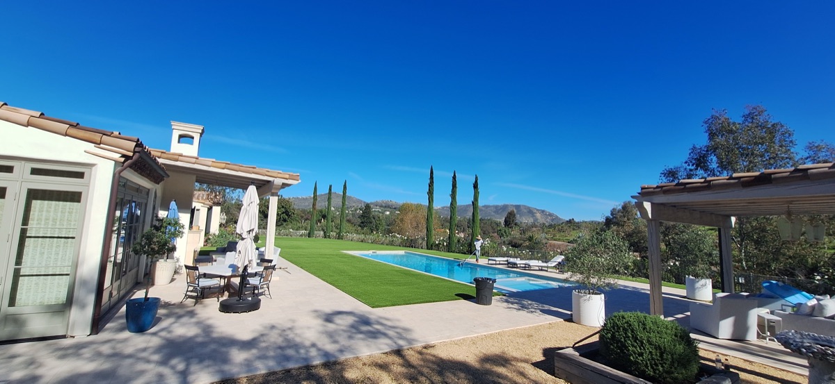 Luxury pool area with turf surround in North County San Diego