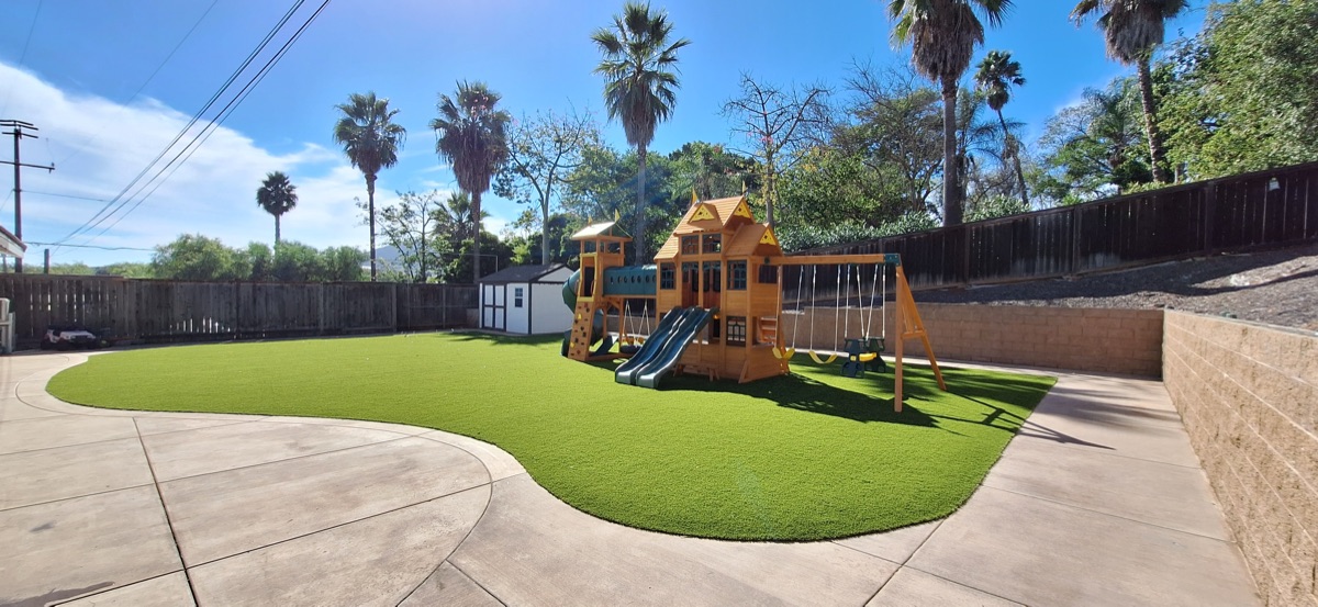Playground turf installation with play structure