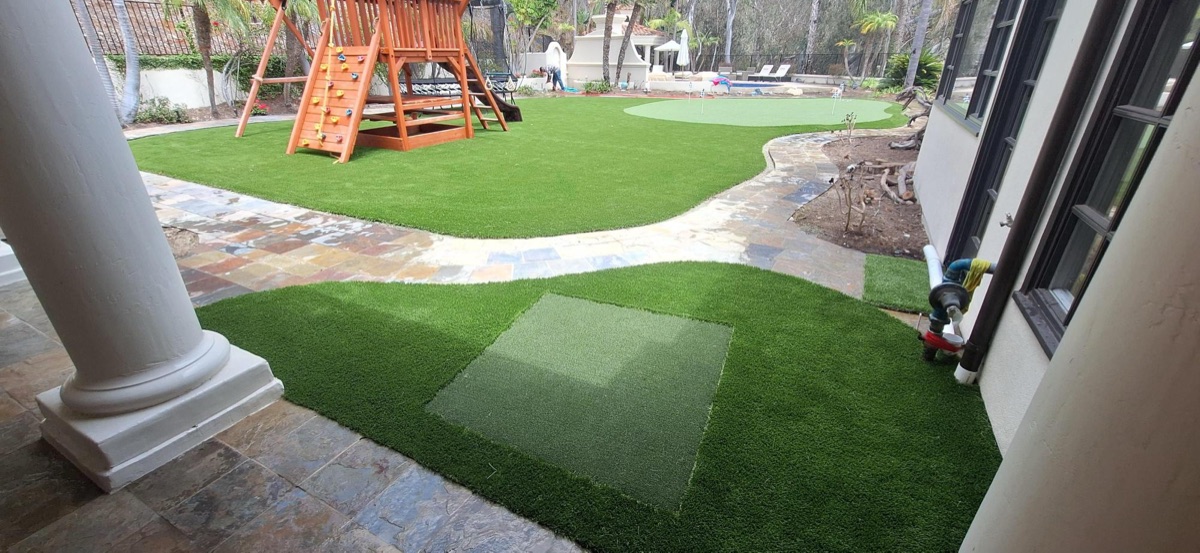 After: artificial turf lawn with playset and putting green in North County San Diego